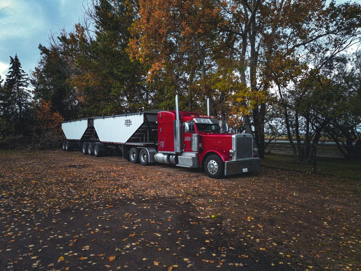 Heavy-duty flatbed truck with specialized loading frame